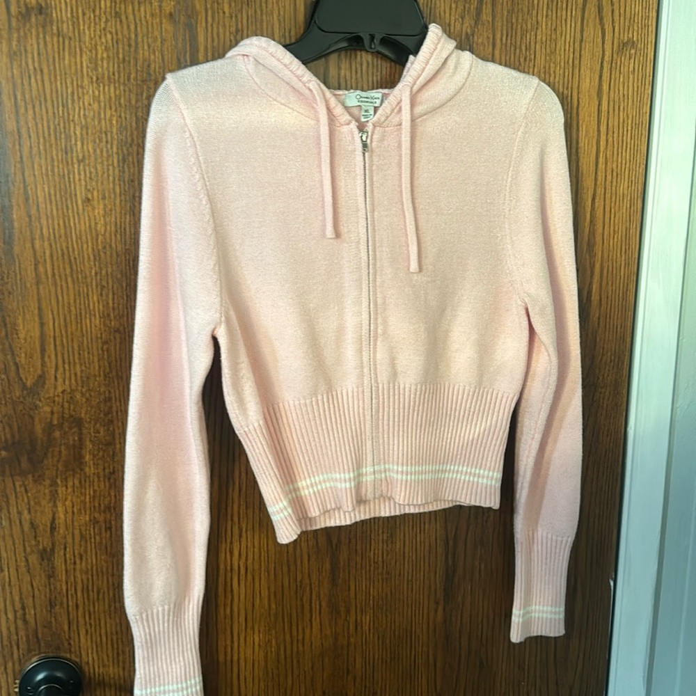 Woman’s light pink, beautiful sweater
